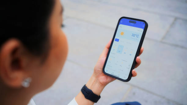 istock Businesswoman Using AI-Powered Weather App on Smartphone 2159763304