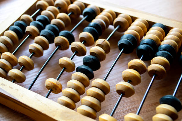 istock Wooden hand abacus lies on a wooden surface 2159763376