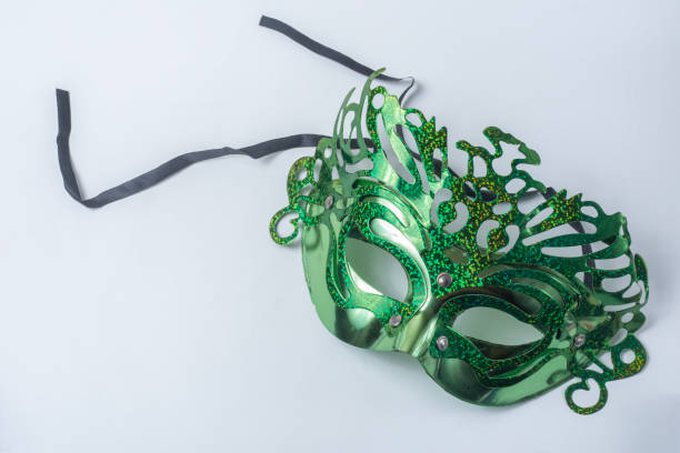 Green carnival mask isolated on white background with copy space for text
