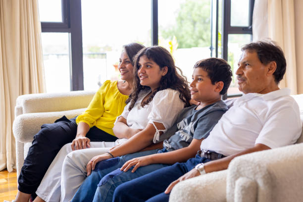 istock Family watching TV 2159766599