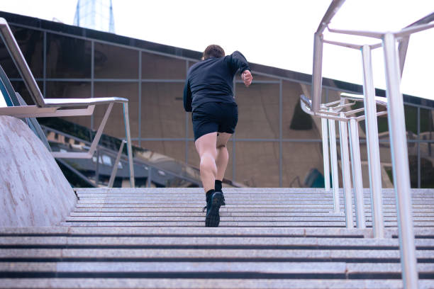 istock Athlete, running down the stairs, doing dynamic exercise outdoors 2159766751