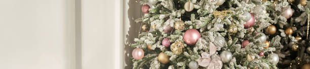 istock Banner. Christmas background with a Christmas tree on a beige crumpled background. Greeting card with copy space 2159768507