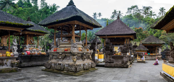 A religious ceremony taking place in Ubud, Bali. Attendees are wearing traditional ceremonial clothing