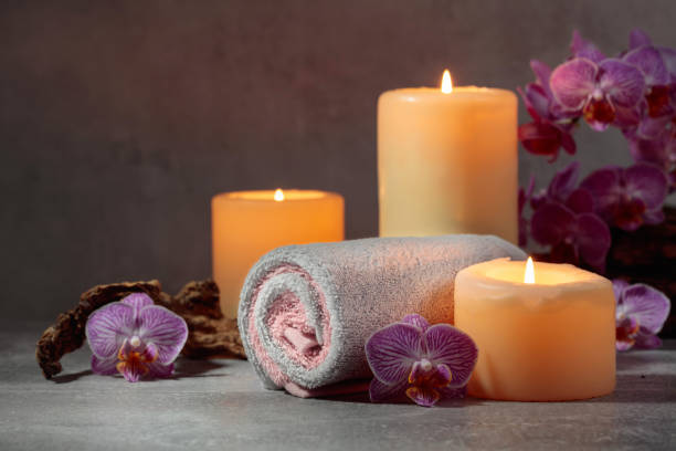 istock Towels, orchid flowers, and burning candles. 2159769783