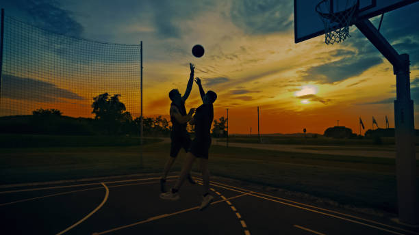 istock Outdoor Basketball Duel During Sunset 2159770934