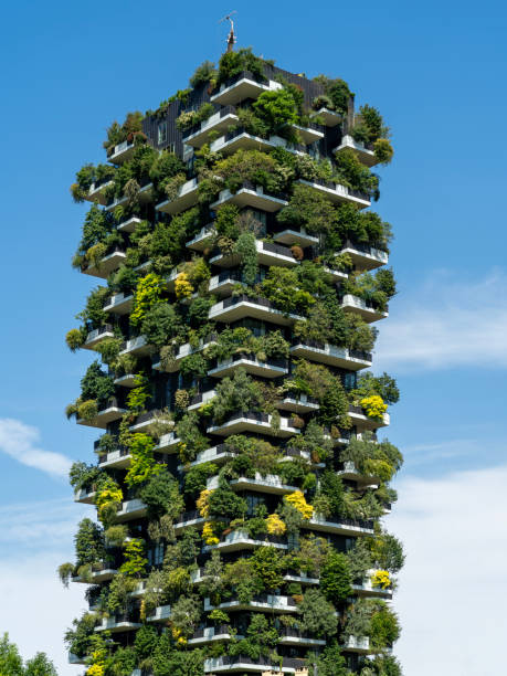 Milano, Italy. Bosco Verticale, a close up view at the modern and ecological skyscrapers with many trees on each balcony. Modern architecture, vertical gardens, terraces with plants