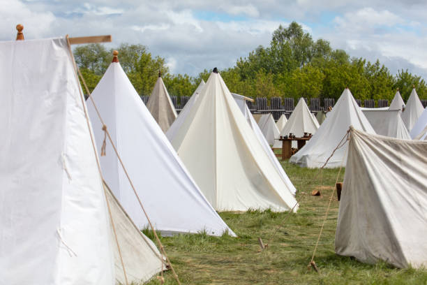 istock White medieval tents in nature in summer 2159771052