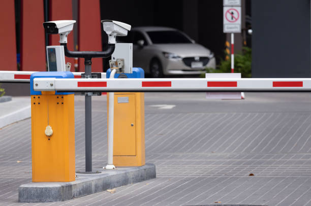 istock A yellow and blue traffic barrier with two cameras on top. automatic entry system 2159771731