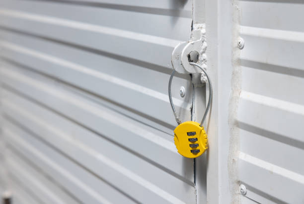 istock A yellow lock with a keyhole on a white door 2159771819
