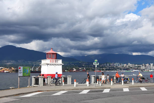 Vancouver, British Columbia, Canada - August 15, 2011: Stanley Park and Vancouver harbor view. Famous Seawall on the 22 kilometers route, where visitors walk, bike, roll and fish. BC Canada