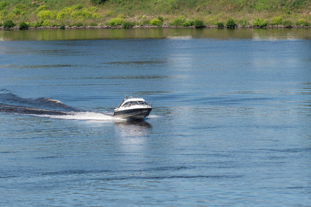 Motor boat goes fast on water.