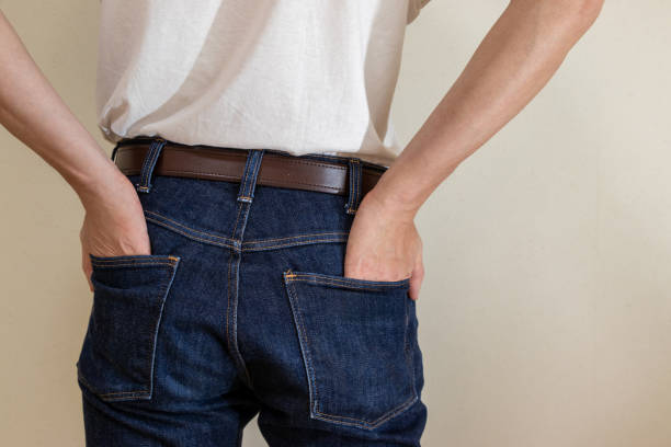 istock Man putting his hands in the back pockets of his jeans 2159775120