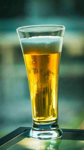 istock Beer in an elegant pint glass with blurred background 2159781110