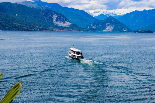 Tourists enjoying a boat trip on a ferry on lake Maggiore, Varese, Italy