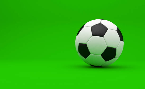 istock Soccer Ball on Green Studio Background. Minimal concept. 2159783317