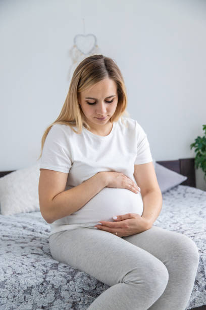 istock Pregnant woman dreaming good mood. Selective focus. 2159784235