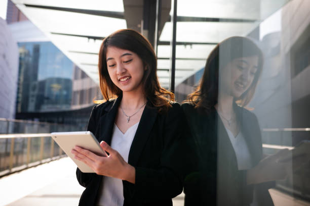 istock Young female entrepreneur with digital tablet in hand 2159784503