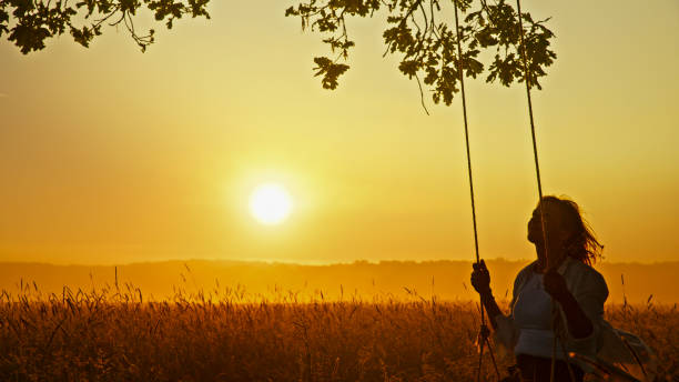 istock Serene Sunset Swing - Mature Woman Savoring Solitude 2159788796