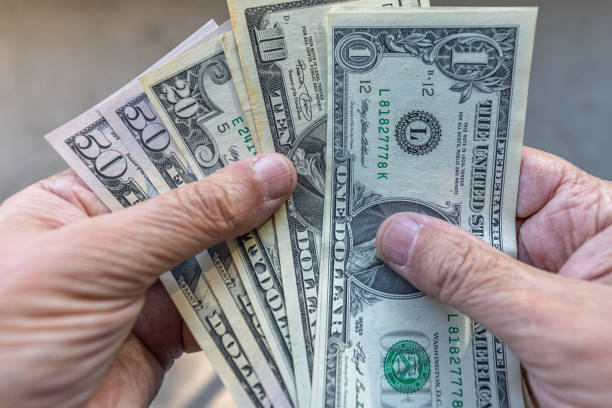 istock Fan of US dollars 2159791381
