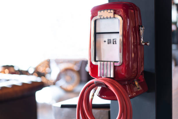 Two pressure gauge with arrows indicating pressure of oil in bar. Pipes and wires out of focus.