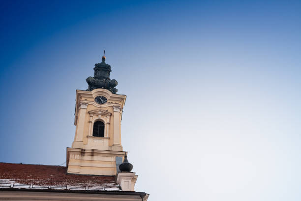 istock Selective blur on a small Serbian orthodox church with a austro hungarian architecture in the region of Banat, in Vojvodina, with a sunny sky at dusk. Serbia is orthodox in Majority. 2159792613