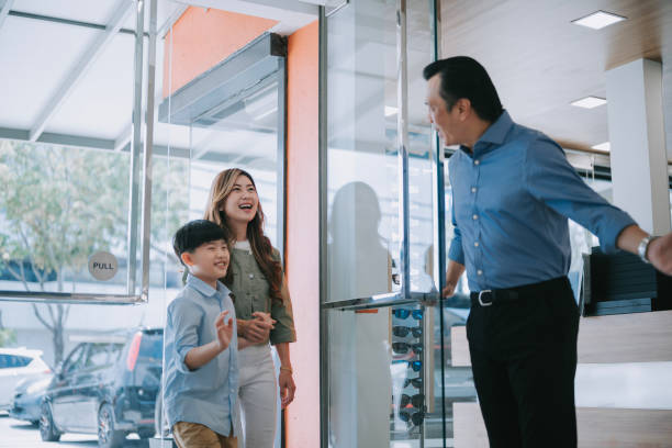 istock retail owner greeting and welcoming his customer at front door 2159798234