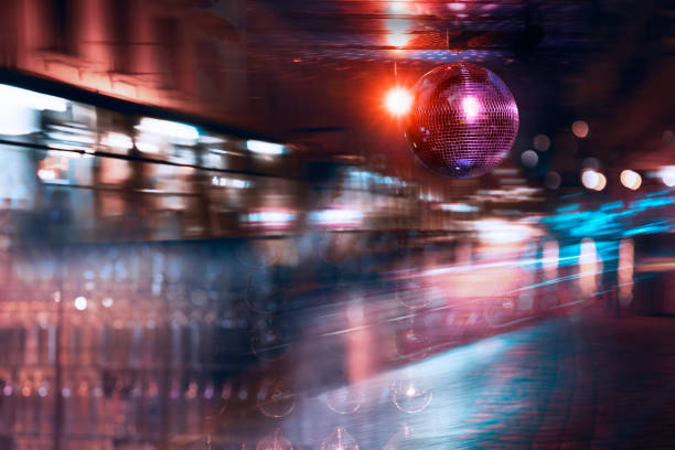istock pink disco ball with blur light party at bar or pub 2159799465