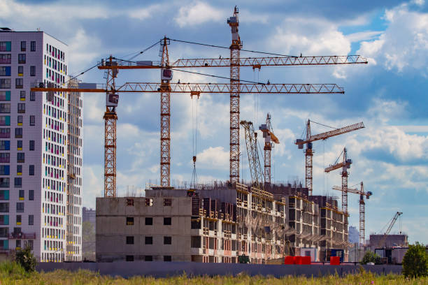 istock Construction. Building a new area. Cranes during operation. High-rise buildings. Designing high-rise buildings. New house is being built next to the already built one. Russia. Buildings in Moscow. 2159799987