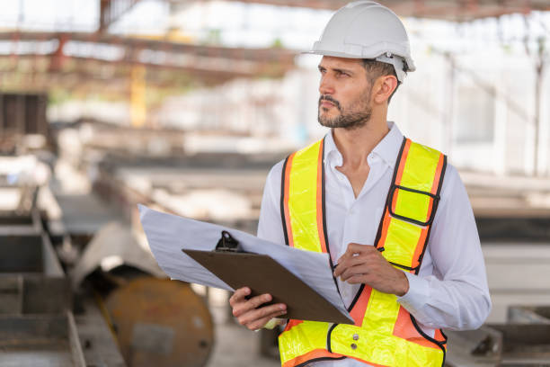 istock Engineer man working at construction site, Foreman worker planning project in the factory site 2159803411