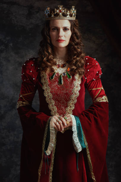 istock medieval queen in red dress with crown 2159804229