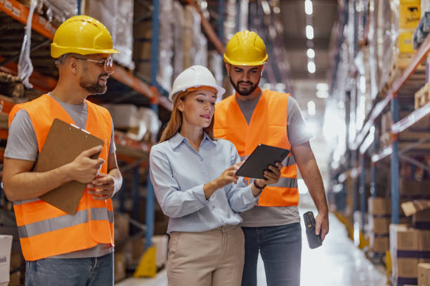 istock Female foreperson Making Plans with Warehousemen 2159806117