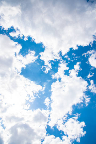white fluffy clouds on a blue sky on a sunny day
