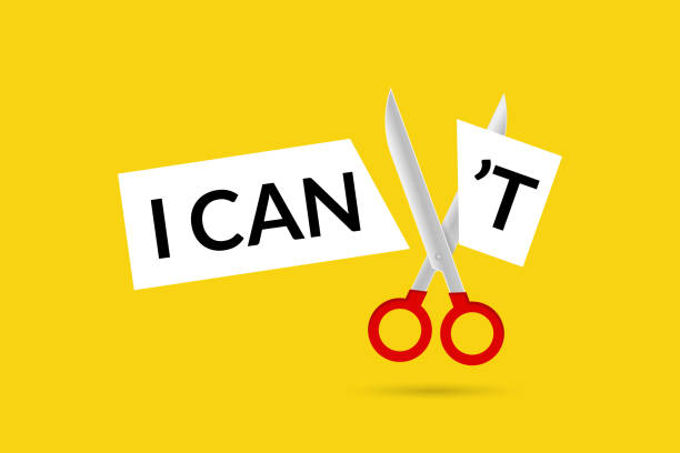 istock A scissor cut the words I can not. Goal achievement, positive mindset, possible, potential and self motivation, overcoming obstacles 2159808989