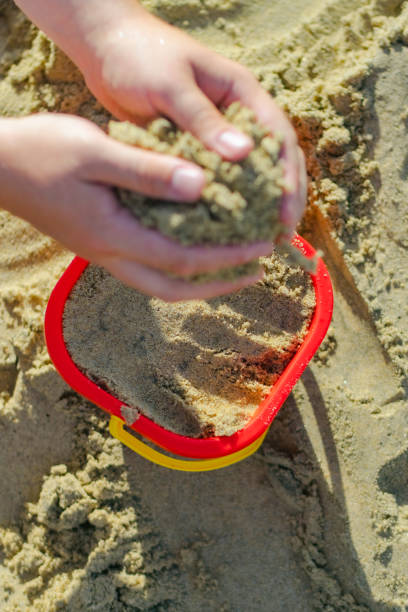istock Playing with sand stock photo 2159811284