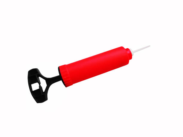 istock Pump for inflating a basketball ball on a white background 2159812148