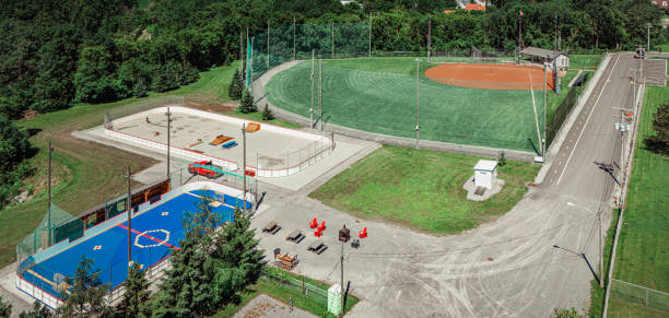 Saint-Hugues, Quebec, Canada, June 28, 2024. An Aerial View of Saint-Hugues: Deck Hockey, Outdoor Ice Rink, and Softball/Baseball Fields.