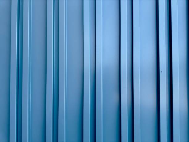 istock A cargo shipping container wall, robust and industrial, features corrugated metal and secure locks, symbolizing strength and global trade in a practical, utilitarian design. 2159812502