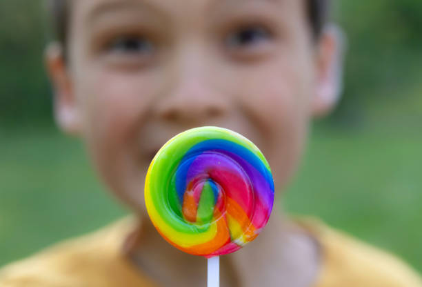 Caucasian male child stare wide-eyed from darkening room close up.