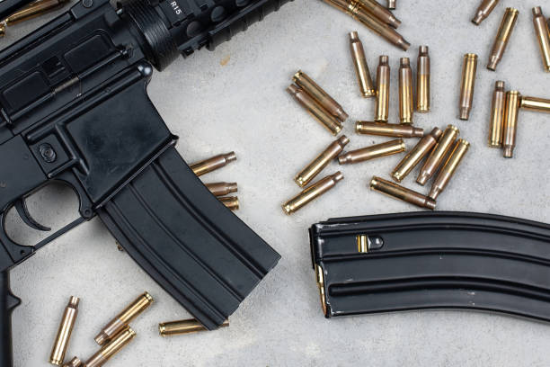 istock M4 carbine and 5.56mm shells and magazine with bullets 2159812947
