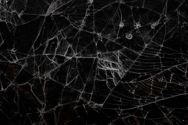 istock Cracked or damaged glass texture.  cracked glass background.  crack pattern 2159814767