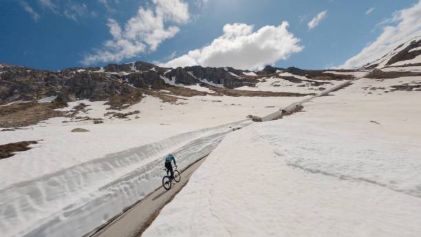 istock Road biker rides up high mountain pass 2159816064