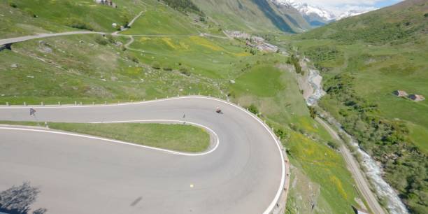 istock Road biker rides up high mountain pass in springtime 2159816085