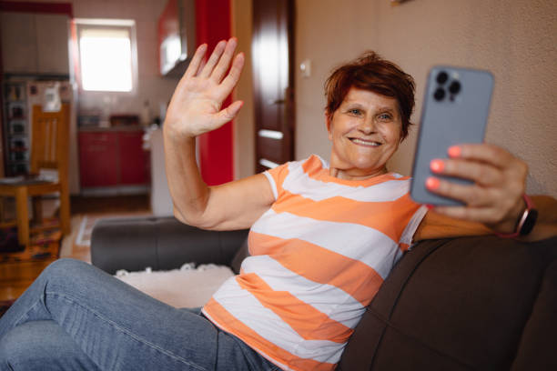 istock Beautiful senior woman using phone 2159819378