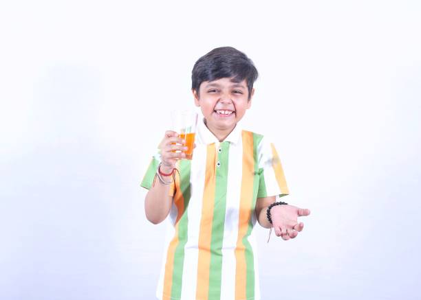 Kids boy drinking seasonal fruit drink
