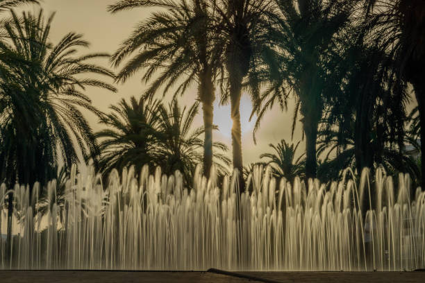 sunset by the magic fountain next to the beach in salou