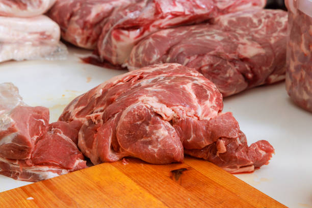 Fresh beef meat slices on cutting board