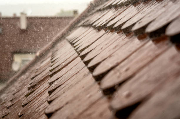 istock Rain patters on a house roof 2159827923