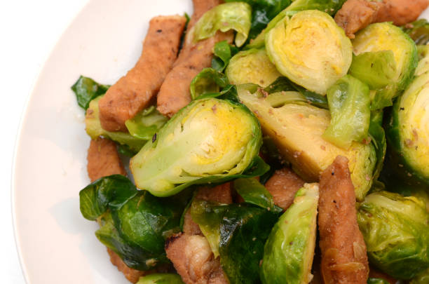Brussel sprouts and tender pork cuisine, food plate