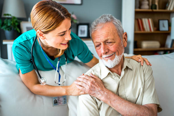istock Senior man being supported by his nurse 2159832444