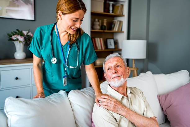 istock Senior man being supported by his nurse 2159832629